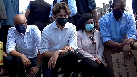 Justin Trudeau takes a knee at a Black Lives Matter/Defund the Police rally in Ottawa