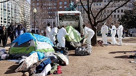 Crews clean up a homeless encampment