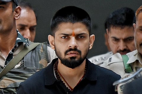 Police escort Lawrence Bishnoi in New Delhi, India, on 18 April 2023