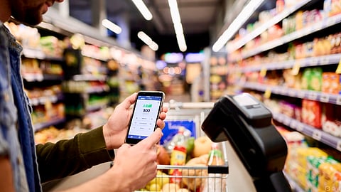 Paying for a purchase in a Canadian grocery store