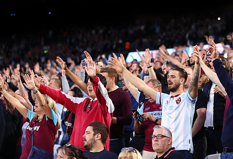 West Ham fans watching their team play at the London Stadium