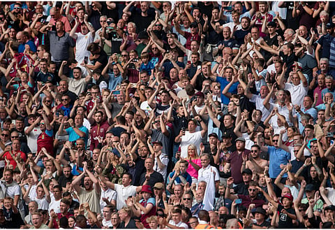 West Ham United supporter in the home end has perfect answer for angry Anderlecht fan
