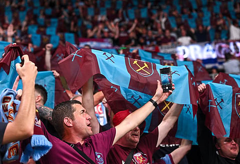 West Ham fans watching their team play