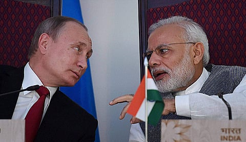 Prime Minister Narendra Modi sharing a word with Russian President Vladimir Putin at the agreement exchange ceremony after the 17th India-Russia annual summit meet in Benaulim Goa on Saturday. | PTI