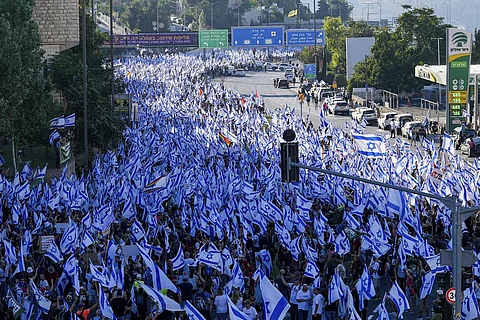 Israel's Netanyahu hospitalized as thousands protest judicial overhaul plan ahead of key vote