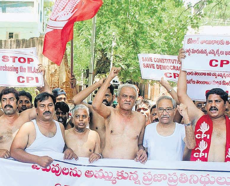 CPI members stage half-naked protests against defection of Telangana ...