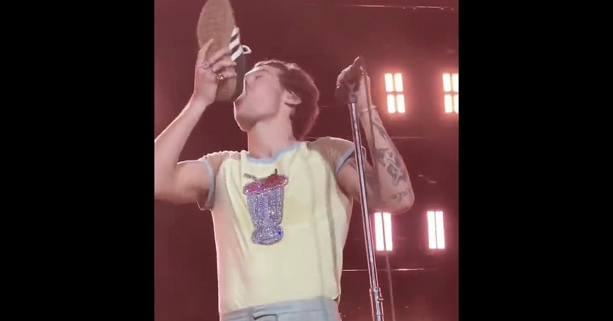 Embracing the 'shoey' Harry Styles drinks out of shoe during Australia