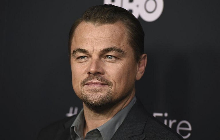 Why did actor Leonardo DiCaprio testify at trial of former Fugees rapper?