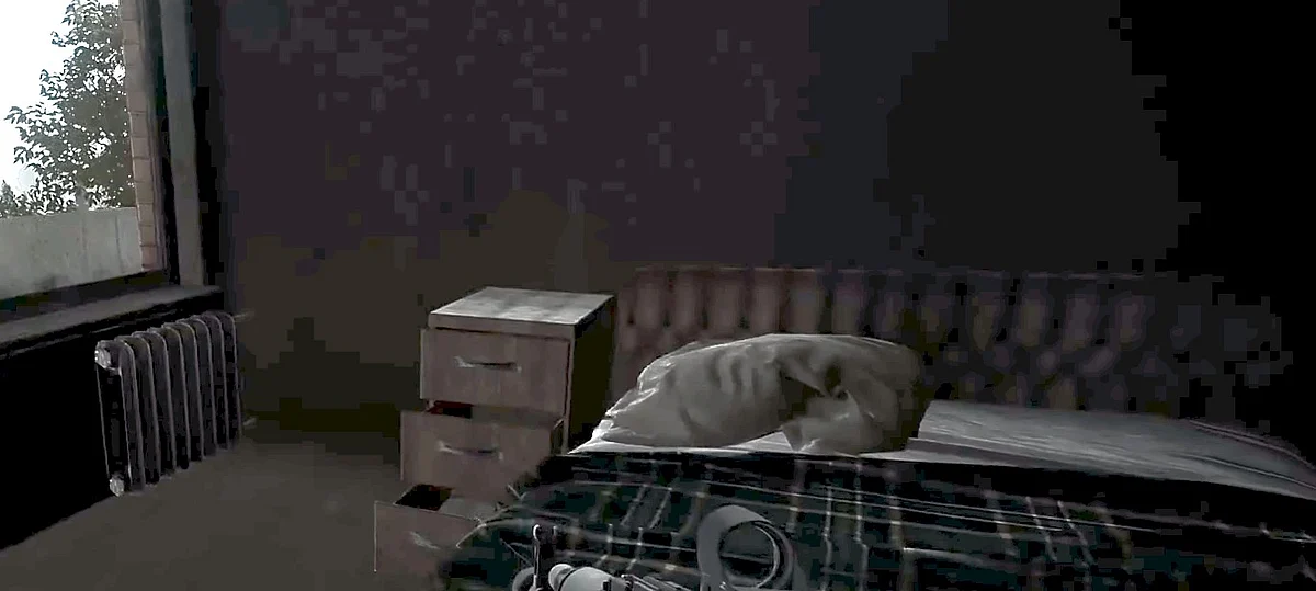 A bed and nightstand next to it.