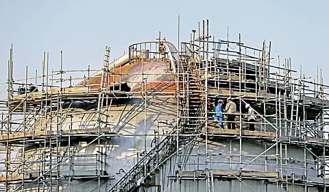 Workers are seen at the damaged site of Saudi Aramco oil facility in Abqaiq, Saudi Arabia. Photo credit to Reuters