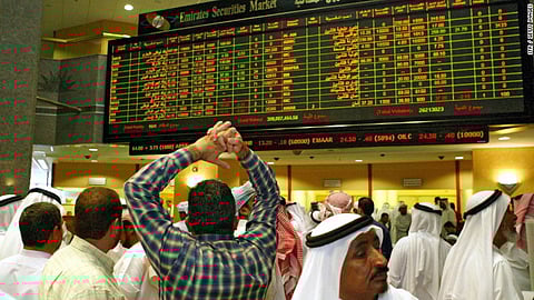 Emirati traders follow the stock market activity at the Dubai Financial Market. (File photo: AFP)
