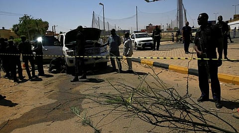 Security personnel stand near a car damaged after an explosion targeting the motorcade of Sudan's Prime Minister Abdalla Hamdok near the Kober Bridge in Khartoum, Sudan March 9, 2020. REUTERS/Mohamed Nureldin Abdalla
