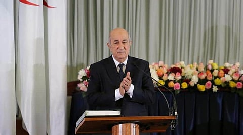 Algerian President Abdelmadjid Tebboune claps during a swearing-in ceremony in Algiers, Algeria December 19, 2019. REUTERS/Ramzi Boudina
