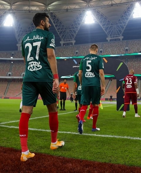 Players in Prince Muhammad Bin Salman Cup don jerseys with names written in Arabic script 