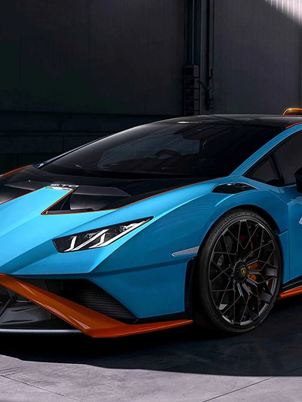  The car also features a large adjustable rear wing, a roof scoop, and rear fenders derived from the Huracan Super Trofeo EVO, all contributing to improved downforce and cooling.