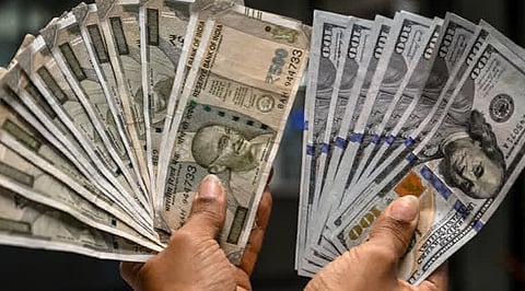 Trending Rupee falls 13 paise to 95.56 as crude rises, Fed hike bets strengthen dollar.