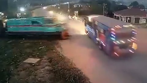 Bus collides with train