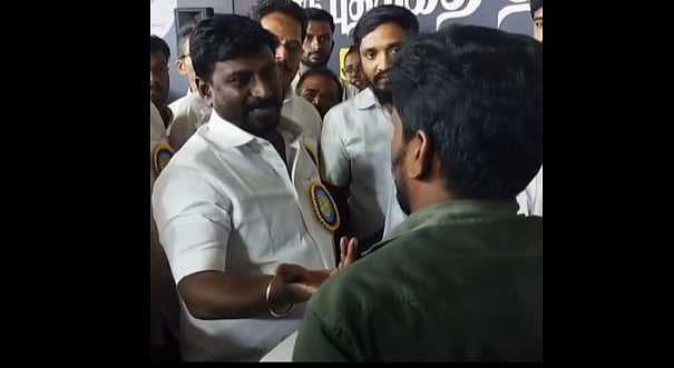 அமைச்சர் முன்பு மண்டியிட்டு மனு தந்த இளைஞர்... நெட்டித் தள்ளிய போலீஸ்!