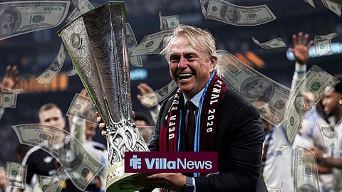 Wes Edens holding the Europa League trophy surrounded by money