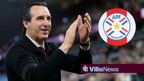 Unai Emery looking happy towards the Paraguay badge