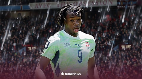 Johan Manzambi in Switzerland kit ahead of rainy background at Villa Park