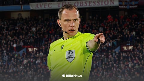 Referee Sebastian Gishamer in action with Villa Park background