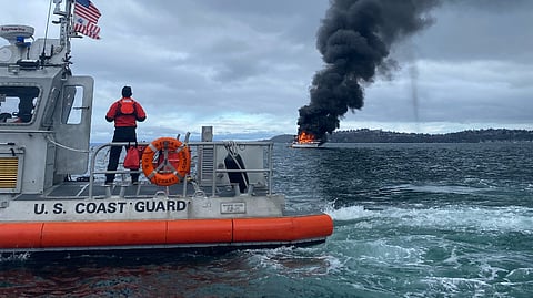 A 45-foot Response Boat Medium boat crew from Coast Guard Station Seattle responds to a recreational vessel fire near Duwamish Head Light in Elliot Bay, Washington, December 8, 2024. Crews from Coast Guard Station Seattle, Seattle Fire, the Washington State Ferry vessel Chimacum, and several Good Samaritans assisted with the response to the fire.