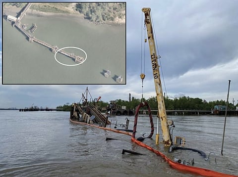 ​​The collapsed crude oil dock, looking upriver. Inset shows the area of the dock that collapsed (circled)