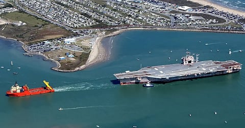 USS John F Kennedy aircraft carrier being towed to shipbreaking yard