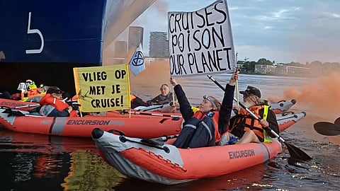 Protesters on inflatable boats attempt to prevent the cruise ship Celebrity Eclipse from docking at the Port of Amsterdam, July 26, 2025.