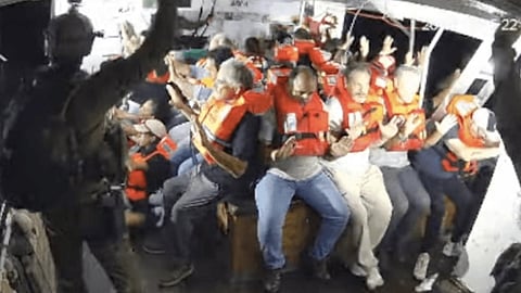 Freedom Flotilla Coalition activists (in lifejackets) following the vessel Handala's seizure by Israeli Navy commandos off Gaza, July 26, 2025