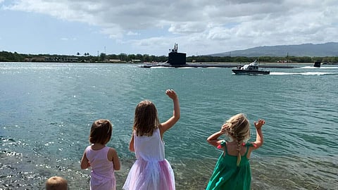A US Navy Virginia-class submarine departing Pearl Harbor, Hawaii