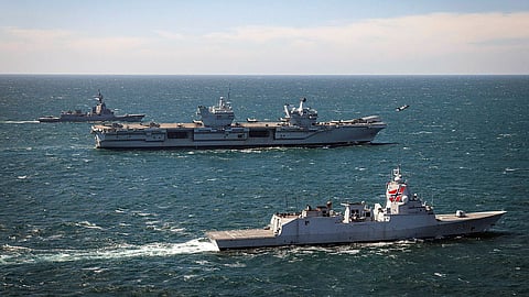 Ships front to back: Norwegian warship HNoMS Roald Amundsen, HMS Prince of Wales, Australian warship HMAS Sydney, with an F-35B taking off from HMS Prince of Wales, July 11, 2025