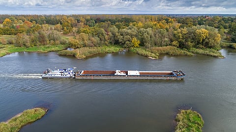Pusher and barge underway