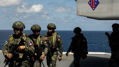 Philippine Marines exit an MV-22B Osprey tiltrotor aircraft during Exercise Alon 23 aboard the Royal Australian Navy landing helicopter dock HMAS Canberra, August 15, 2023.