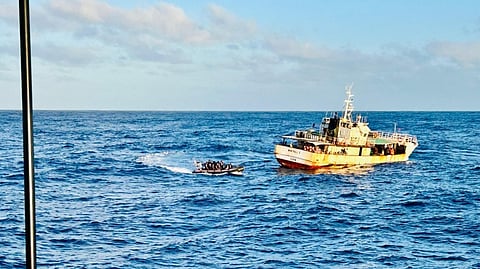 Fiji Navy approaching a fishing vessel during a boarding and inspection at sea