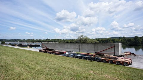 A prefabricated wall beam awaits barge delivery to the Chickamauga Lock Replacement Project’s upstream approach wall contract near Watts Bar Dam