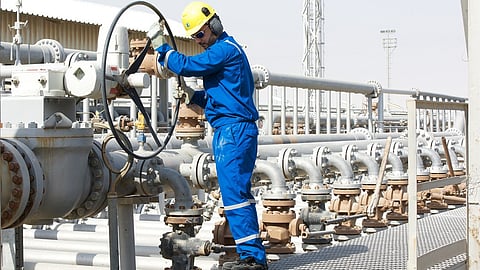 Personnel working on Kuwait Petroleum Corp pipeline