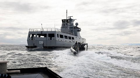 HMAS Ballarat's boarding party approaches Royal Brunei Navy ship KDB Darulaman during a maritime exercise off the coast of Brunei Darussalam during Exercise Penguin.