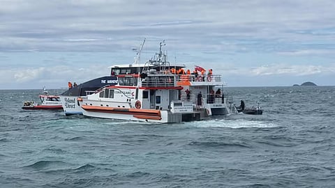 Coastguard New Zealand vessels alongside the ferry during the evacuation effort