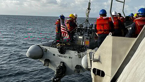 The crew of the US Navy littoral combat ship USS Cincinnati conducts small boat operations and a personnel transfer with the Royal Malaysian Navy guided-missile frigate KD Lekiu during the sea phase of Cooperation Afloat Readiness and Training Malaysia 2025 in the Strait of Malacca, December 8, 2025.