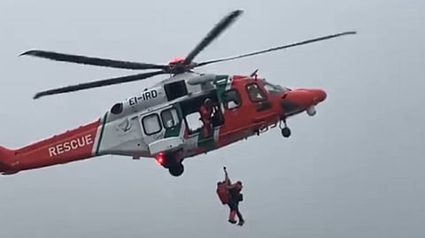 One of the crew of the grounded trawler Fastnet is being hoisted aboard an Irish Coast Guard AW189 helicopter, December 14, 2025.