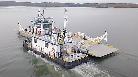 Summitt assisting the deck barge Volunteer