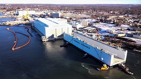 Atlas being positioned parallel to the South Yard Assembly Building at General Dynamic Electric Boat's shipyard in Groton, Connecticut