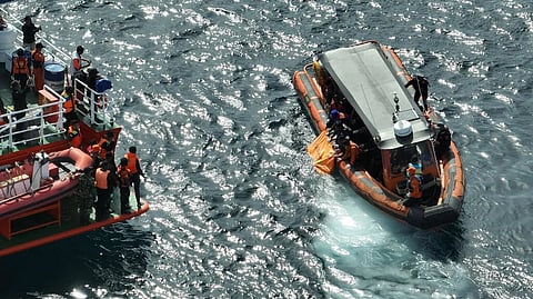 Personnel from Indonesia's Basarnas national search and rescue agency recover the remains of a passenger who perished after the tour boat Putri Sakinah capsized off Komodo National Park in East Nusa Tenggara province, January 4, 2026.