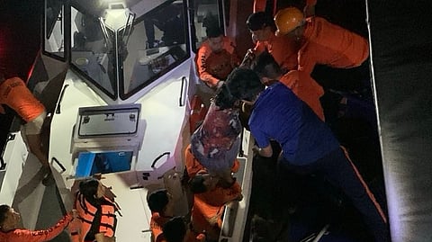 Survivors of the sinking of the ferry Trisha Kerstin 3 off the Philippines' Basilan province are brought aboard a Philippine Coast Guard vessel, January 26, 2026. The incident left at least 15 people dead.