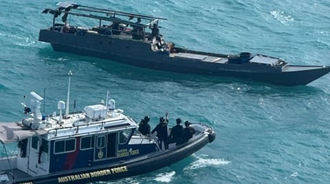 An Australian Border Force patrol boat moves to intercept one of two foreign vessels suspected of illegal fishing in Australian waters between February 14 and 15, 2026.