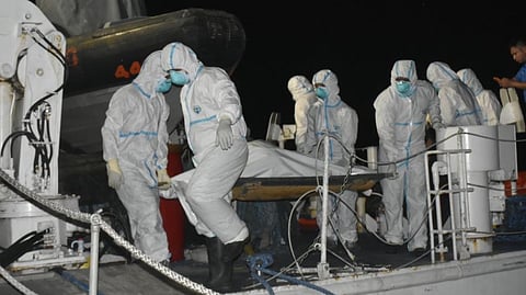 Philippine Coast Guard personnel prepare to offload the recently recovered remains of one of the victims of the sinking of the ferry Trisha Kerstin 3 off Basilan province. As of February 17, 2026, 62 people who were on the ferry when it sank are confirmed dead while 17 others are still missing.