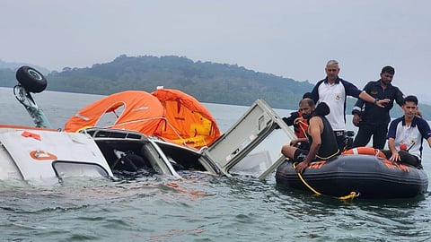 Indian Coast Guard personnel bring the occupants of the crashed helicopter onto an inflatable boat near Mayabander Harbour in the Andaman Islands, February 24, 2026. The helicopter had been forced to make an emergency landing in the water due to a technical malfunction.