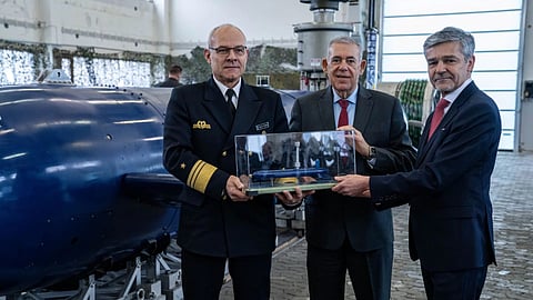 Representatives of the German Navy, TKMS, and Israel Aerospace Industries stand beside a BlueWhale AUV acquired by the German Navy.